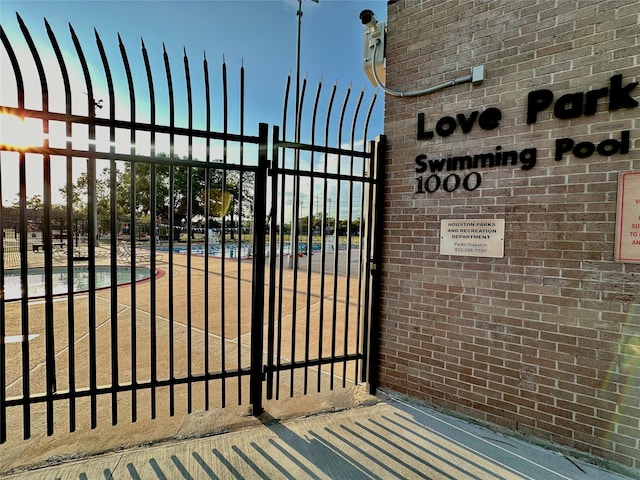 view of gate with fence