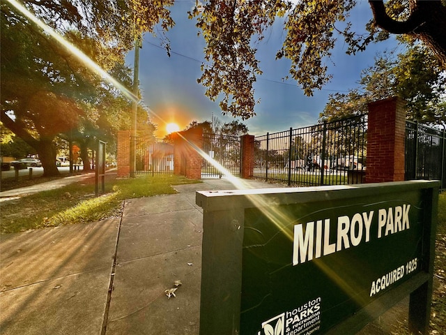 view of home's community featuring fence