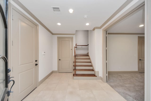 entrance foyer featuring recessed lighting, visible vents, and crown molding