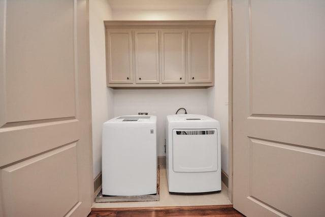 laundry area with cabinet space and washer and clothes dryer