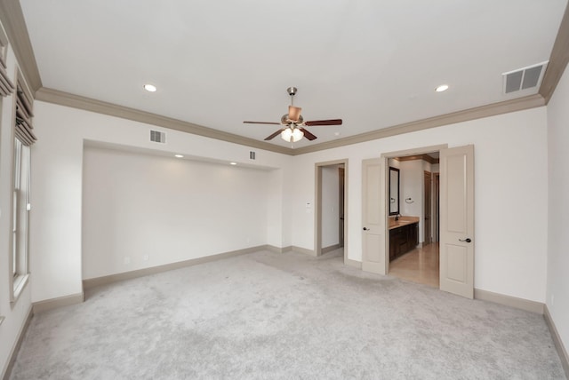 unfurnished bedroom featuring ornamental molding, visible vents, light carpet, and baseboards