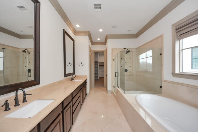 314 W Clay St, Houston, TX 77019 - full bathroom featuring crown molding, a shower stall, a bath, double vanity, and tile patterned floors