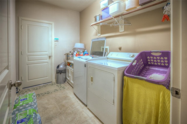 laundry room with laundry area and washing machine and clothes dryer