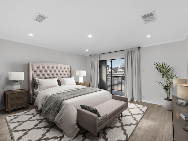 bedroom with access to exterior, visible vents, and light wood finished floors