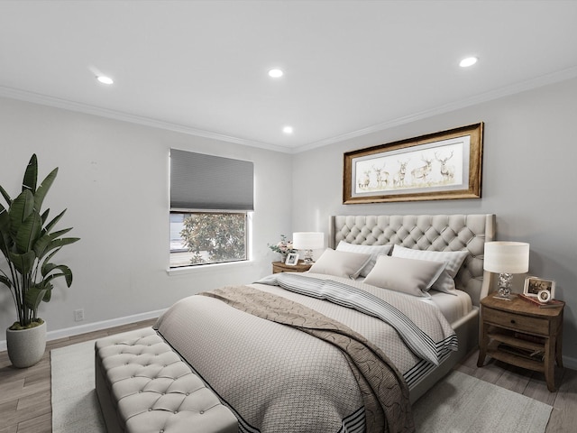 bedroom featuring ornamental molding, light wood-type flooring, recessed lighting, and baseboards