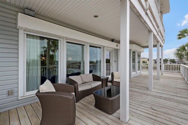 wooden deck with an outdoor hangout area