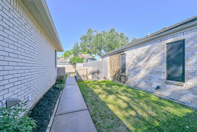 view of yard featuring a gate and fence