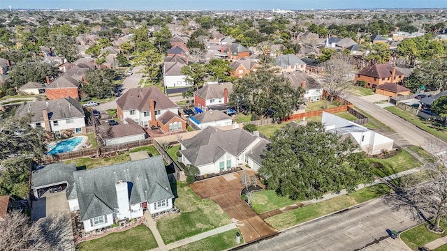 birds eye view of property with a residential view