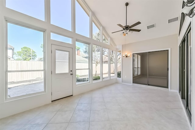 unfurnished sunroom featuring visible vents and a healthy amount of sunlight