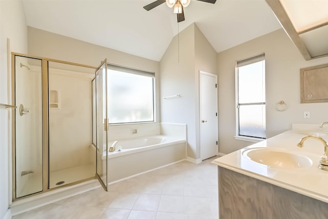 bathroom featuring double vanity, vaulted ceiling, a sink, a shower stall, and a bath