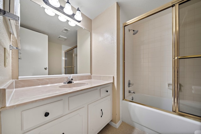 full bath with visible vents, shower / bath combination with glass door, and vanity