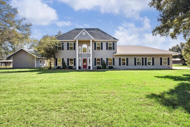 neoclassical / greek revival house featuring a front lawn