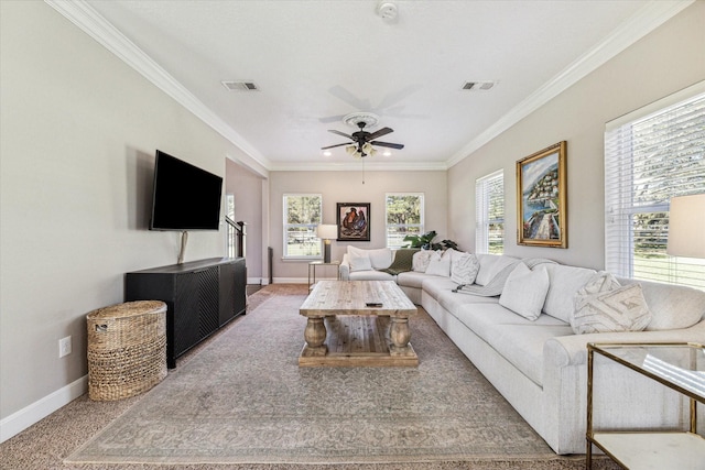 carpeted living room with ornamental molding, visible vents, baseboards, and a ceiling fan