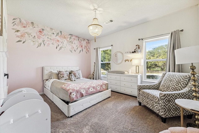 carpeted bedroom featuring visible vents and an inviting chandelier