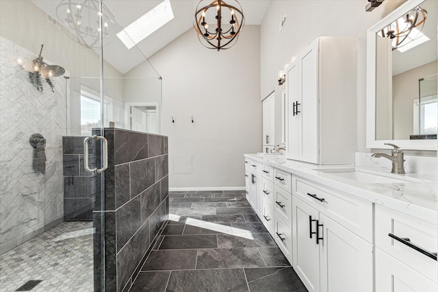 bathroom featuring double vanity, a sink, and a wealth of natural light