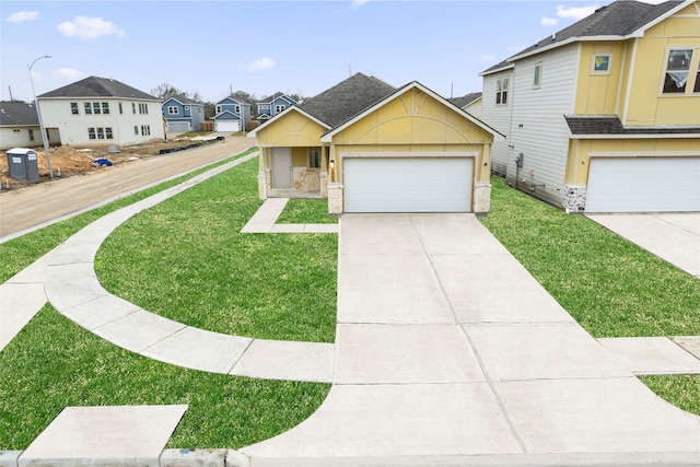 view of front of home with driveway, roof with shingles, a front yard, and a residential view