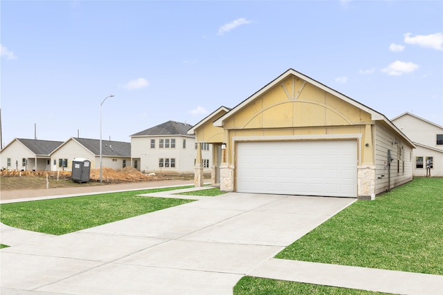 ranch-style house with a garage, concrete driveway, and a front lawn