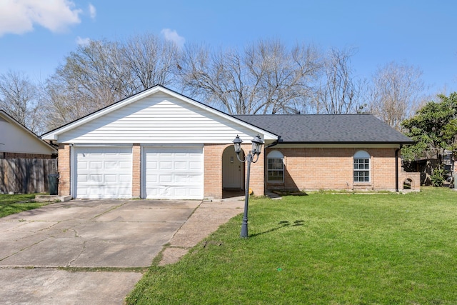 single story home with brick siding, roof with shingles, concrete driveway, an attached garage, and a front yard