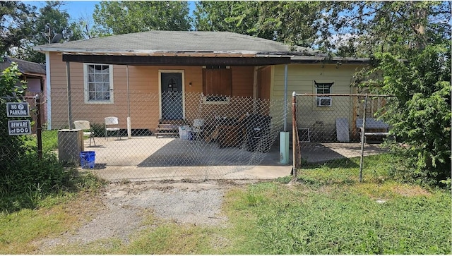 view of front of house featuring fence