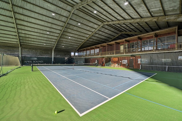 view of tennis court with fence