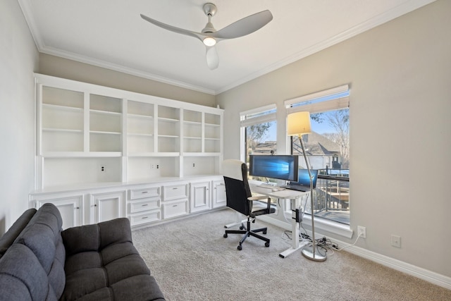 office with light carpet, ceiling fan, baseboards, and crown molding