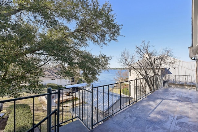 balcony featuring a water view