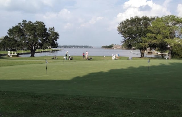 view of community featuring a water view and golf course view