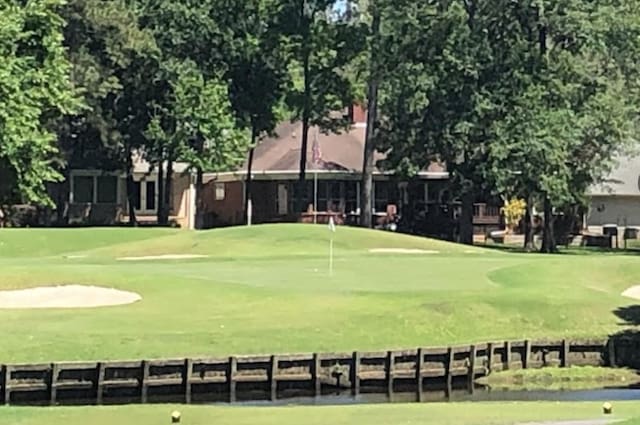 view of home's community featuring golf course view