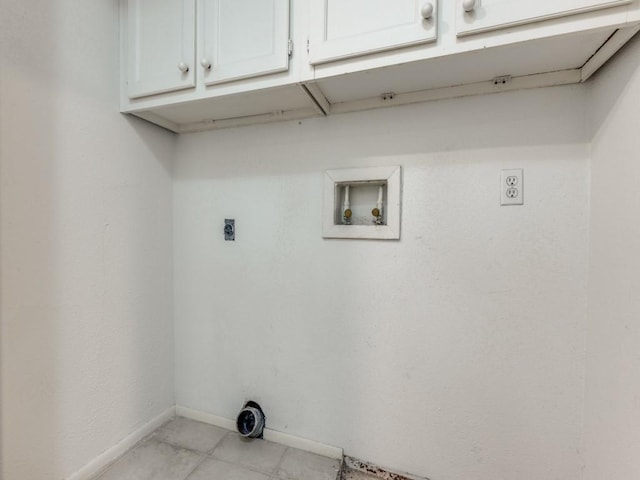 laundry room with hookup for a washing machine, cabinet space, electric dryer hookup, and baseboards