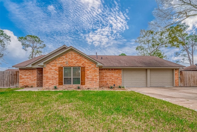 single story home featuring concrete driveway, brick siding, a front yard, and fence