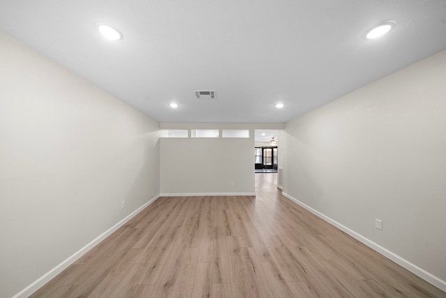 spare room featuring visible vents, recessed lighting, light wood-style flooring, and baseboards