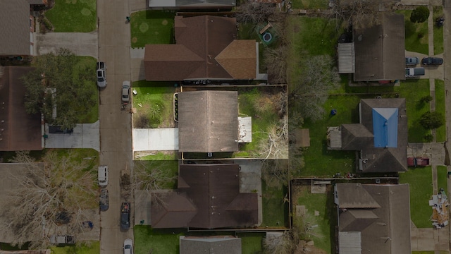 birds eye view of property with a residential view