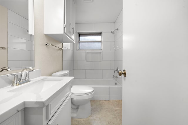 full bath featuring toilet, tile patterned flooring, washtub / shower combination, and vanity