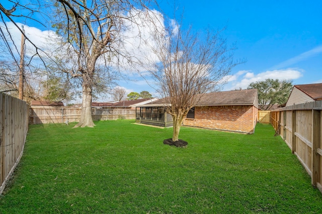 view of yard with a fenced backyard