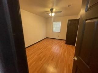 unfurnished bedroom featuring light wood finished floors and ceiling fan