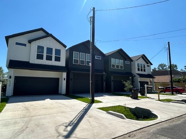 view of front of home featuring an attached garage, driveway, and board and batten siding