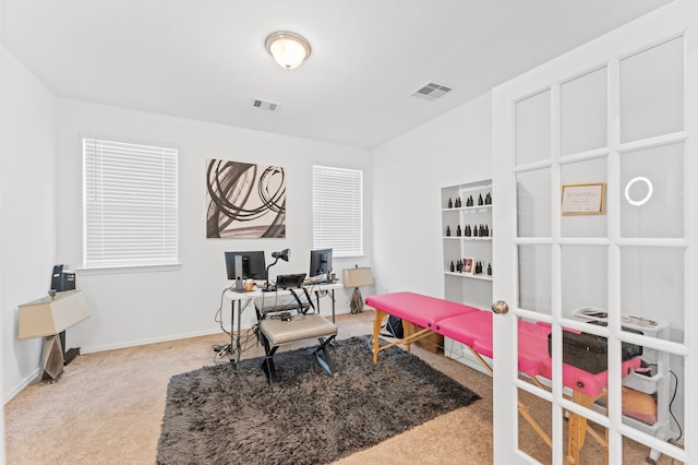 bedroom featuring light colored carpet, french doors, visible vents, and baseboards