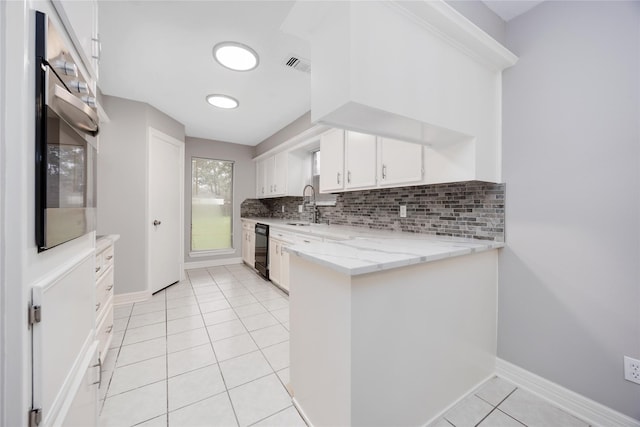 kitchen with visible vents, white cabinets, dishwasher, light stone counters, and a peninsula