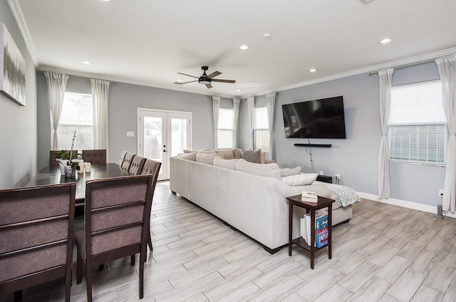 living area featuring recessed lighting, ornamental molding, and ceiling fan