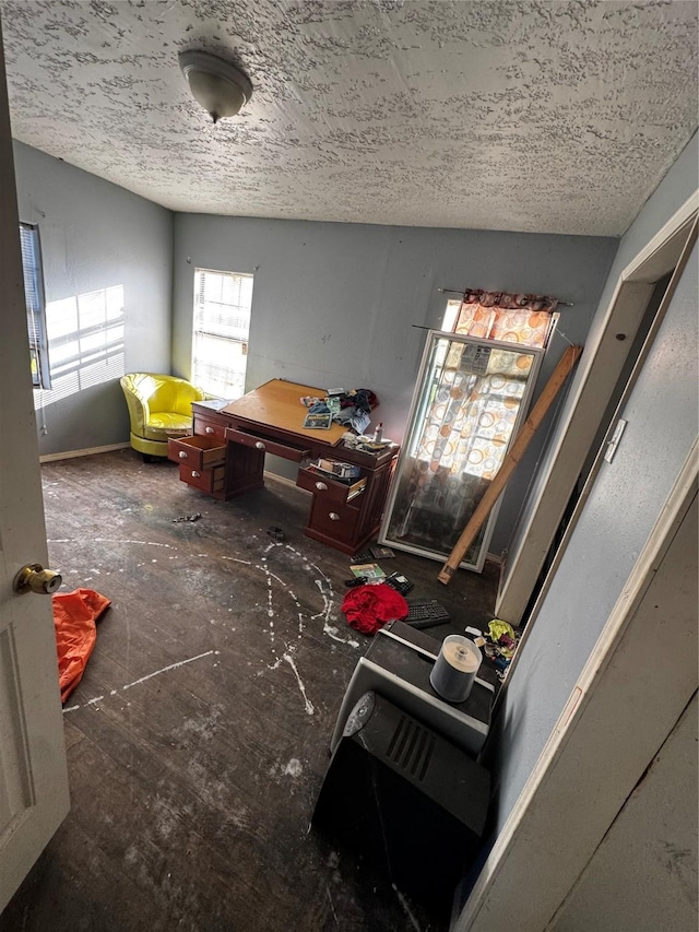 interior space with a textured ceiling