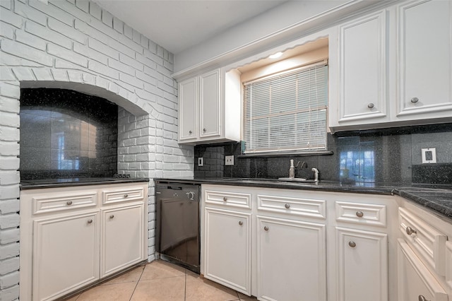 kitchen featuring black dishwasher, white cabinets, and decorative backsplash
