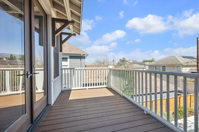 wooden deck featuring a residential view