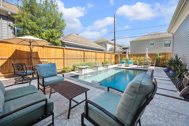 view of pool featuring a patio area, a fenced backyard, outdoor lounge area, and a fenced in pool