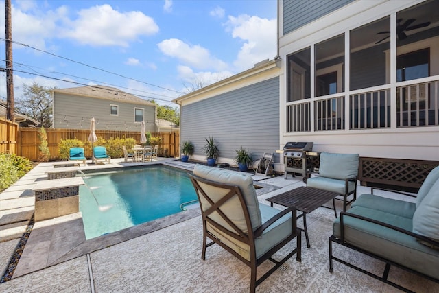 view of swimming pool featuring a fenced in pool, an outdoor hangout area, a grill, fence, and a patio area