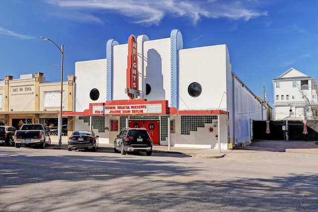 view of building exterior featuring uncovered parking