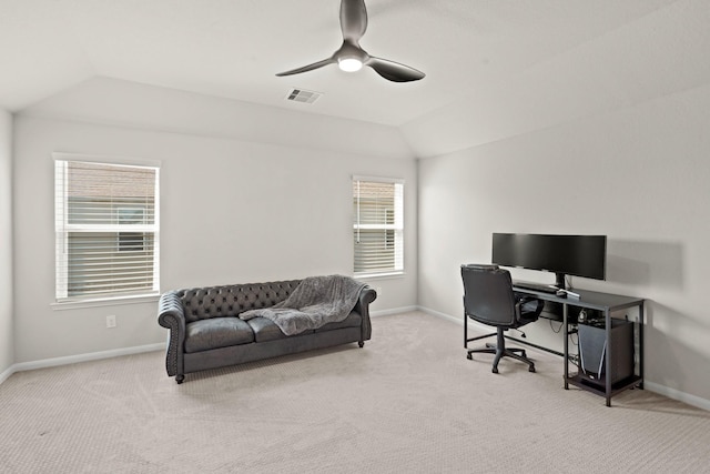 office space featuring light carpet, visible vents, baseboards, ceiling fan, and vaulted ceiling