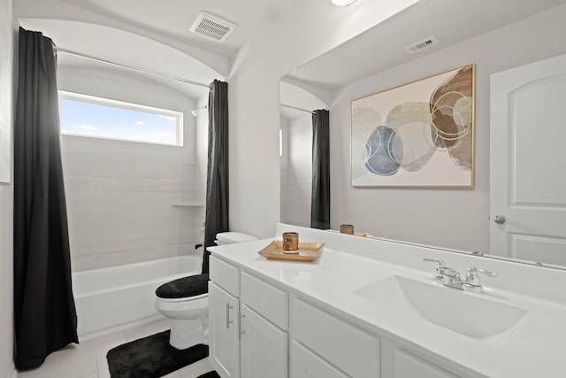 bathroom with visible vents, shower / tub combo with curtain, vanity, and toilet