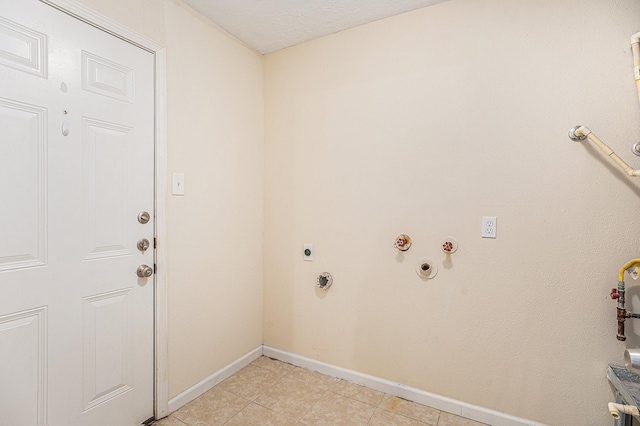 laundry room featuring hookup for a gas dryer, laundry area, electric dryer hookup, and baseboards