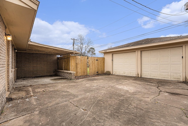 detached garage featuring a gate