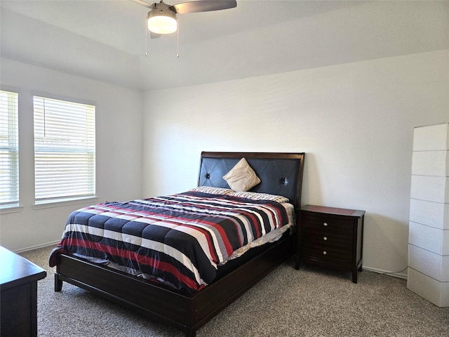 bedroom featuring carpet, vaulted ceiling, and ceiling fan